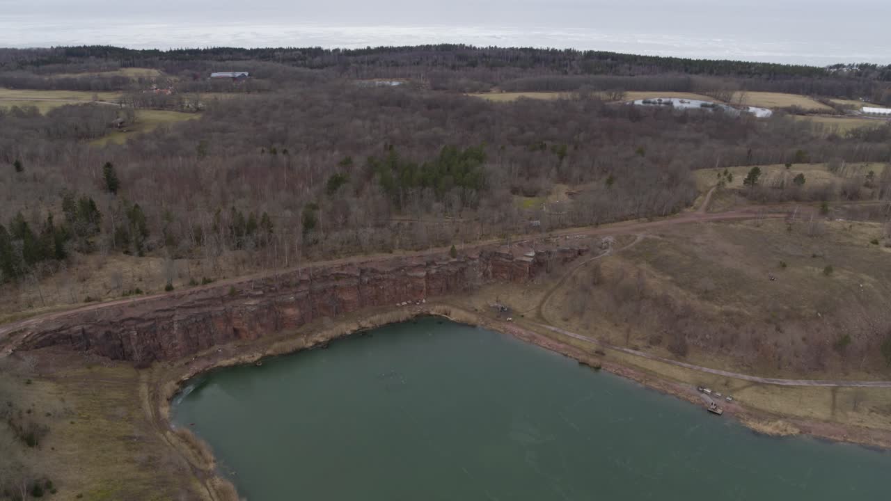 Slow Aerial view drone flight over lake in Kinnekulle Sweden