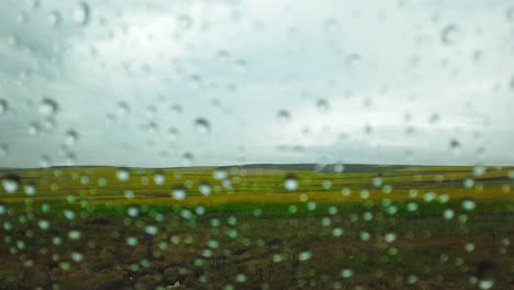 slow motion:rain drop on the car glass
