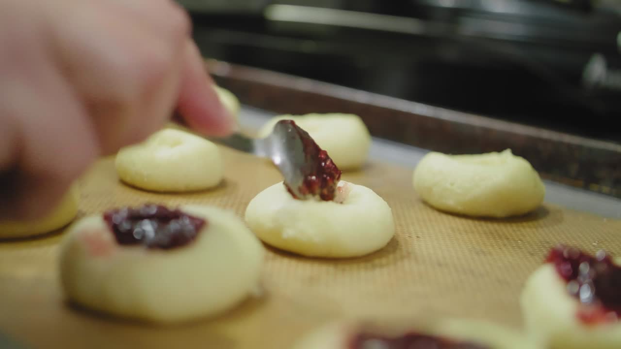Filling Cookies with Raspberry Jam