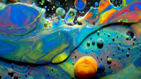 slow motion bright colors bubbles oil beautiful paint universe color moving multicolored closeup. acrylic paint. fantastic surface. abstract colorful paint metamorphosis structure colorful bubbles