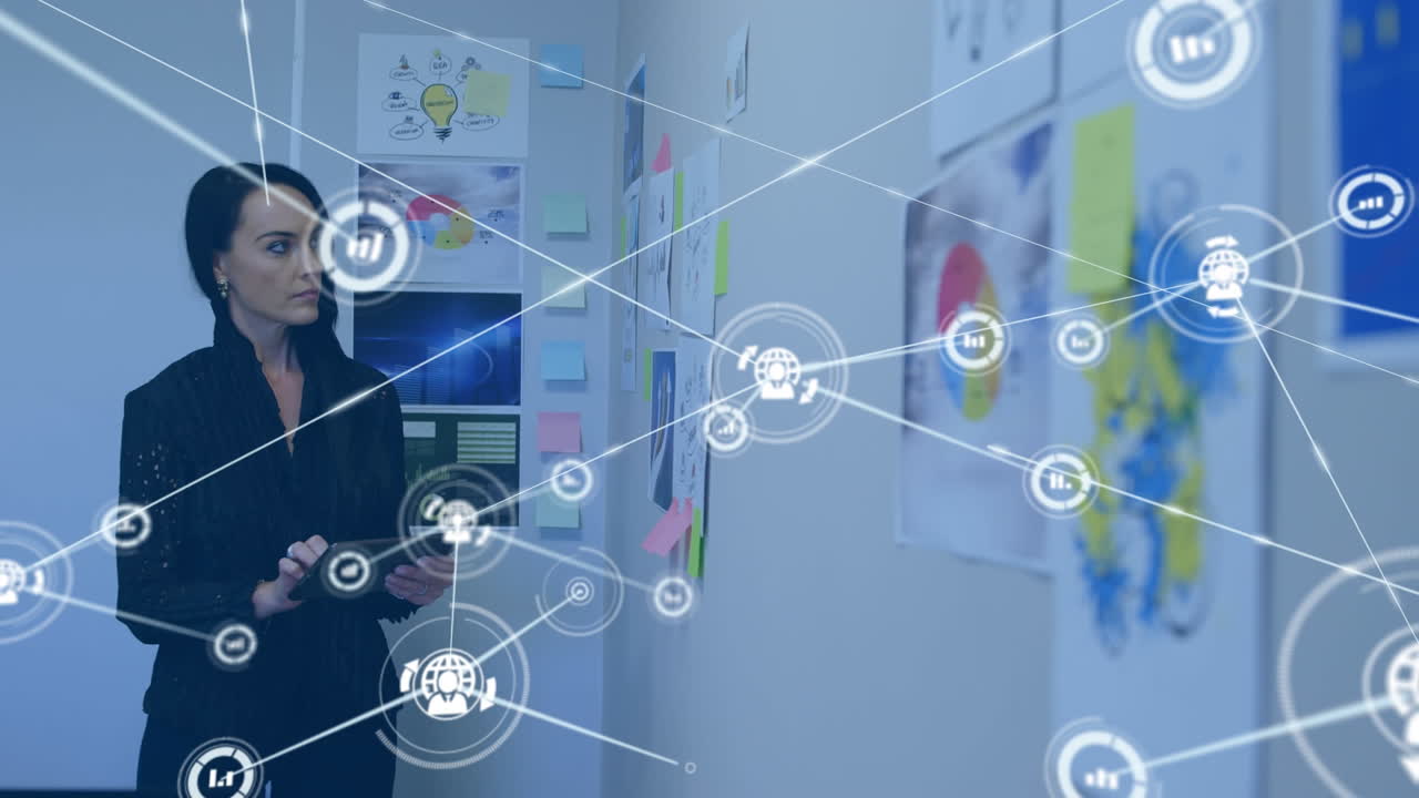 Animation of network of digital icons over caucasian woman using digital tablet at office