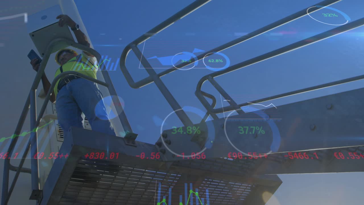 Technician ascending platform with tablet scanning blade at wind farm monitoring metrics live