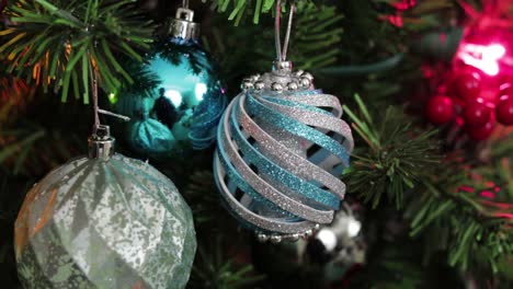 blue christmas ornaments, hanging from the tree