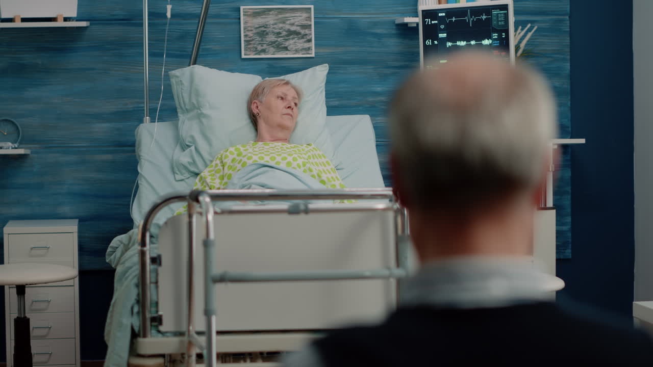 Woman with disease resting in hospital bed with IV drip bag