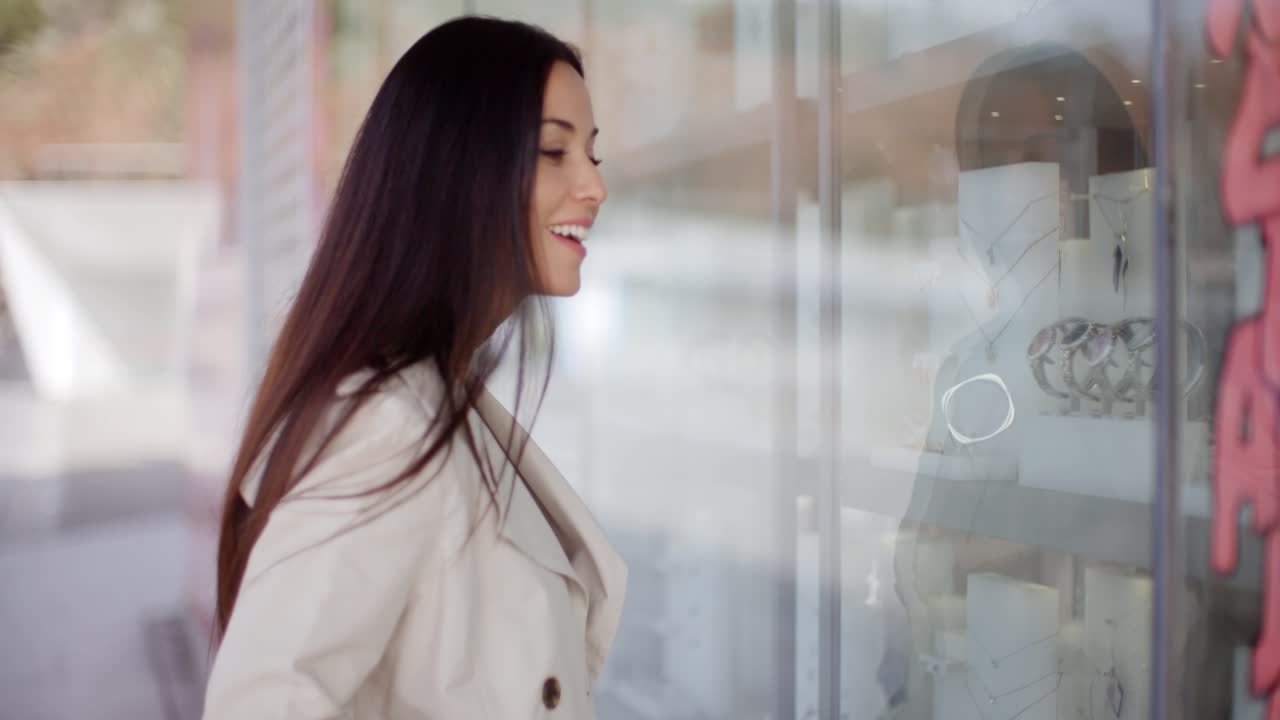 Laughing vivacious woman in a town street