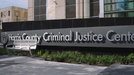 establishing shot of the harris county criminal justice center in houston, texas