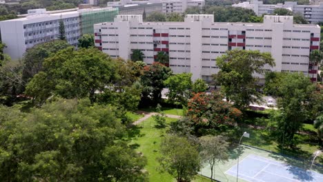 Modern-Brazilian-housing-complex-surrounded-by-urban-nature,-aerial