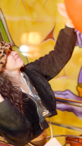 woman enjoying an amusement park ride with motion blur