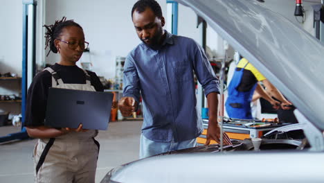 engineer does checkup on client car