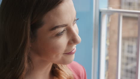 Portrait-of-beautiful-woman-at-her-window