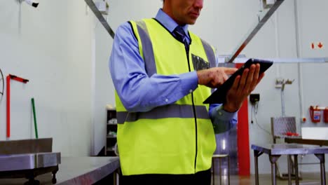 worker using digital tablet