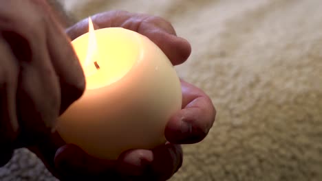 slow motion, lighting a round candle