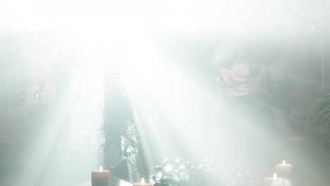 woman decorating christmas tree with light rays