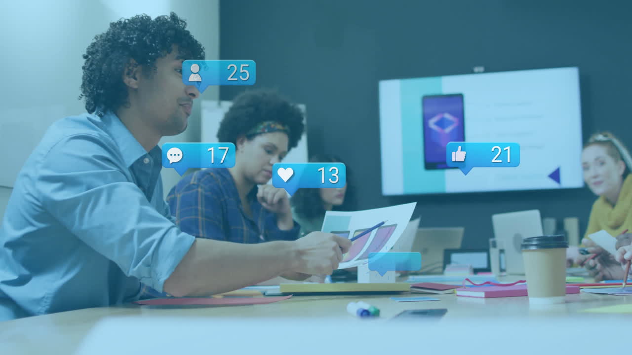 In office, diverse team discussing project with animation of notifications overlay