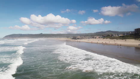 Cannon-Beach-at-high-tide-as-water-meets-the-shore