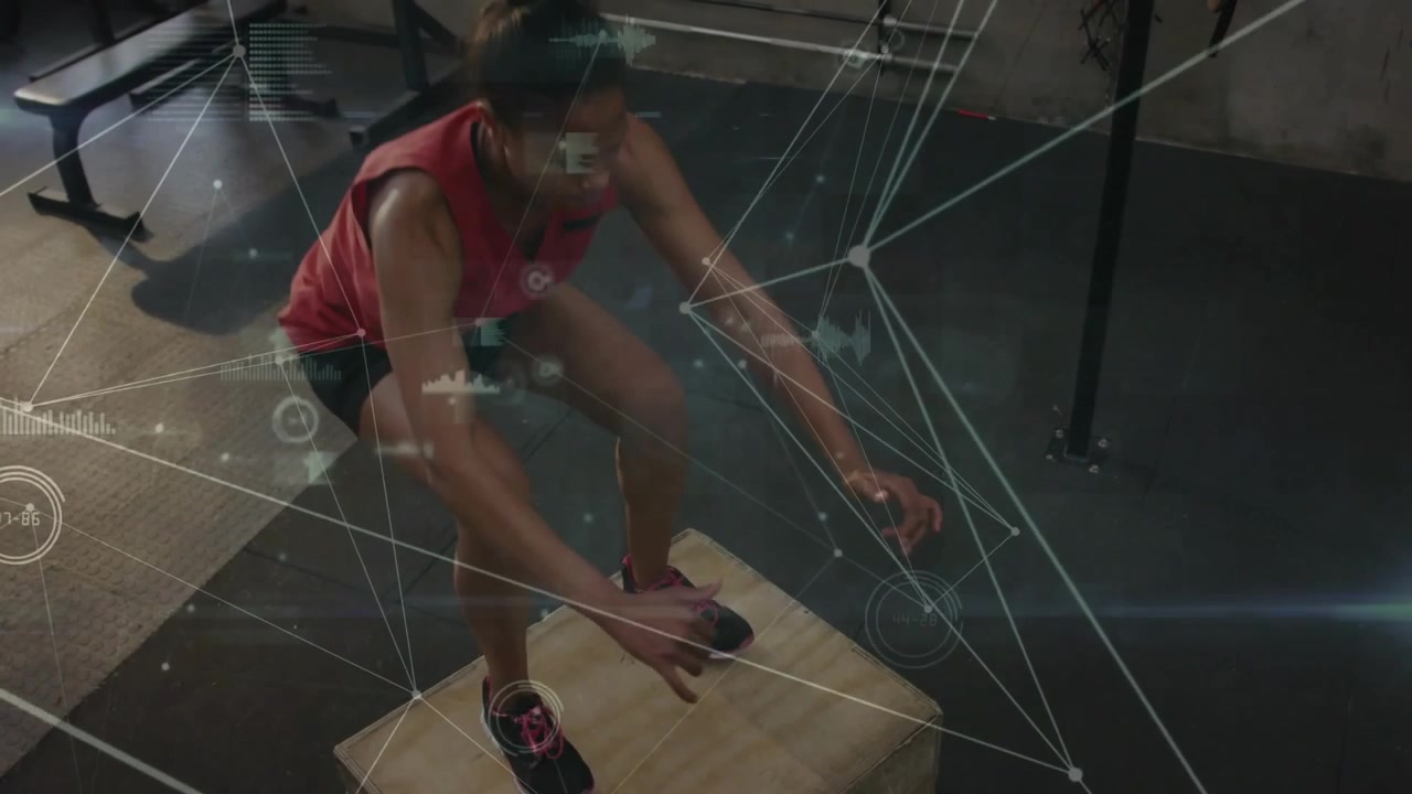 Woman doing box jumps for power, squatting then swinging arms, jumping landing, HUD tracking