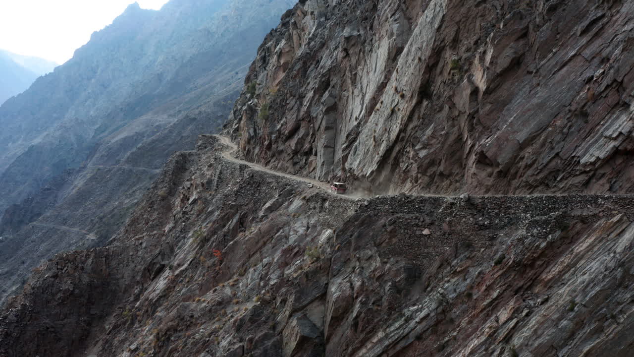 Car driving on the dangerous mountain road to Fairy Meadows, Himalaya
