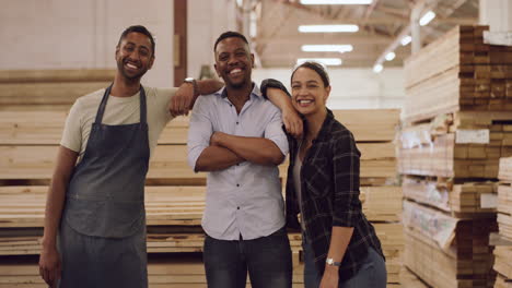 happy woodworking team in warehouse