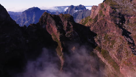 Aerial-view-over-rocky-peaks,-in-Pico-Do-Arieiro,-Madeira---rising,-drone-shot