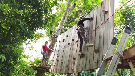 adventurous climbing wall experience in a tropical forest