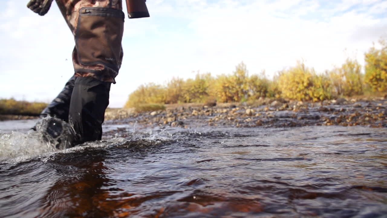 Person wading through a stream