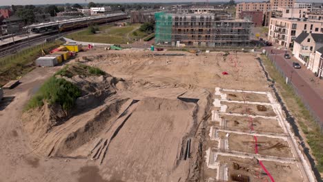 ascending aerial movement and reveal of noorderhaven neighbourhood ubuntuplein construction site in urban development real estate investment project