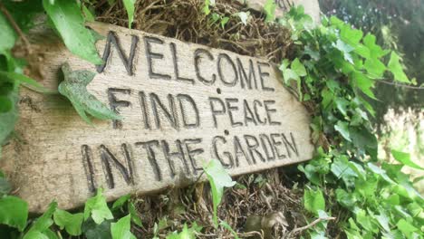 welcome find peace in the garden sign at entrance to relaxing botanical garden