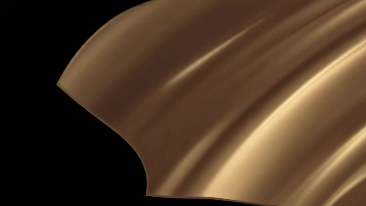 Golden Silk Fabric Unfolding Against a Black Background