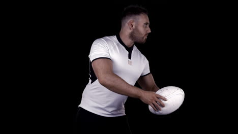 serious rugby player with ball