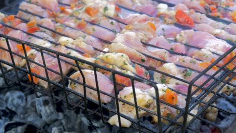 Cooking-meat-on-old-rusty-outdoor-BBQ-grill,-close-up-shot