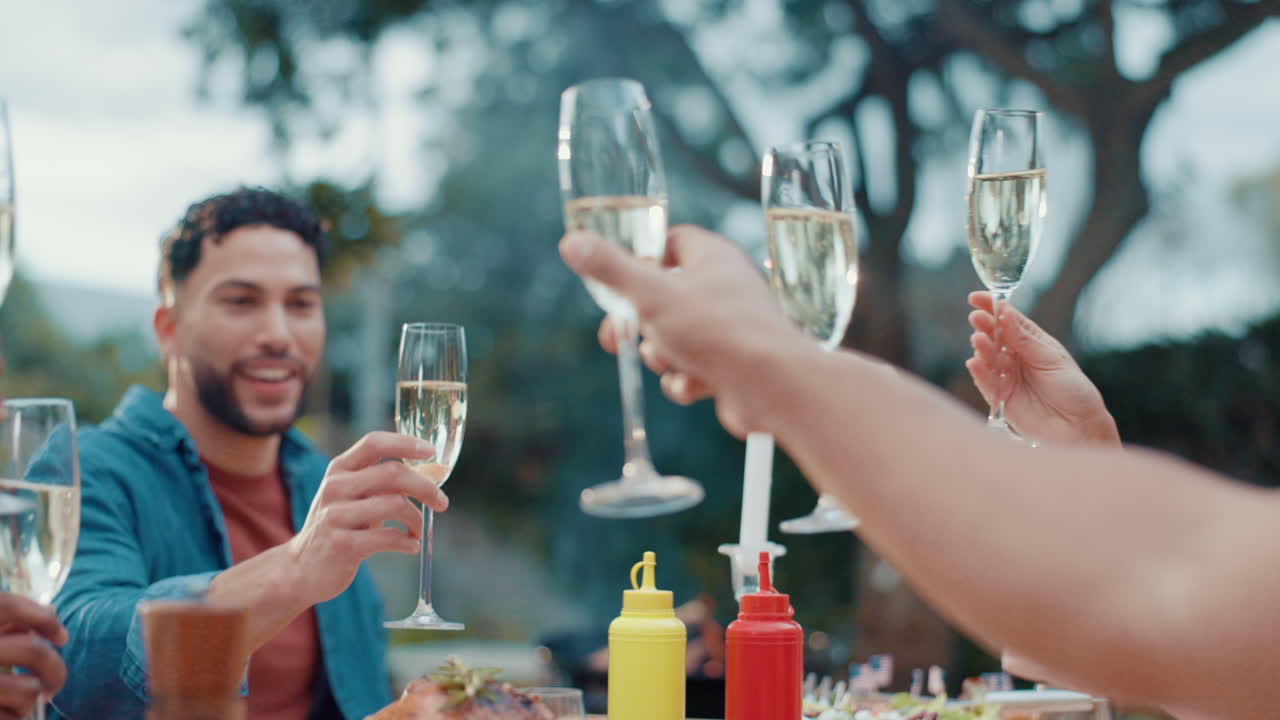 Friends toasting with champagne flutes at an outdoor celebration