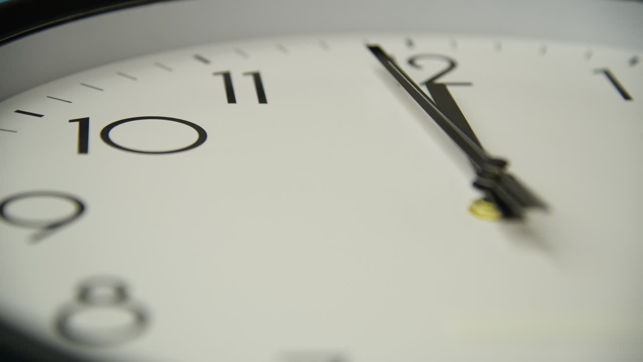Detail of black wall clock to 12 o'clock