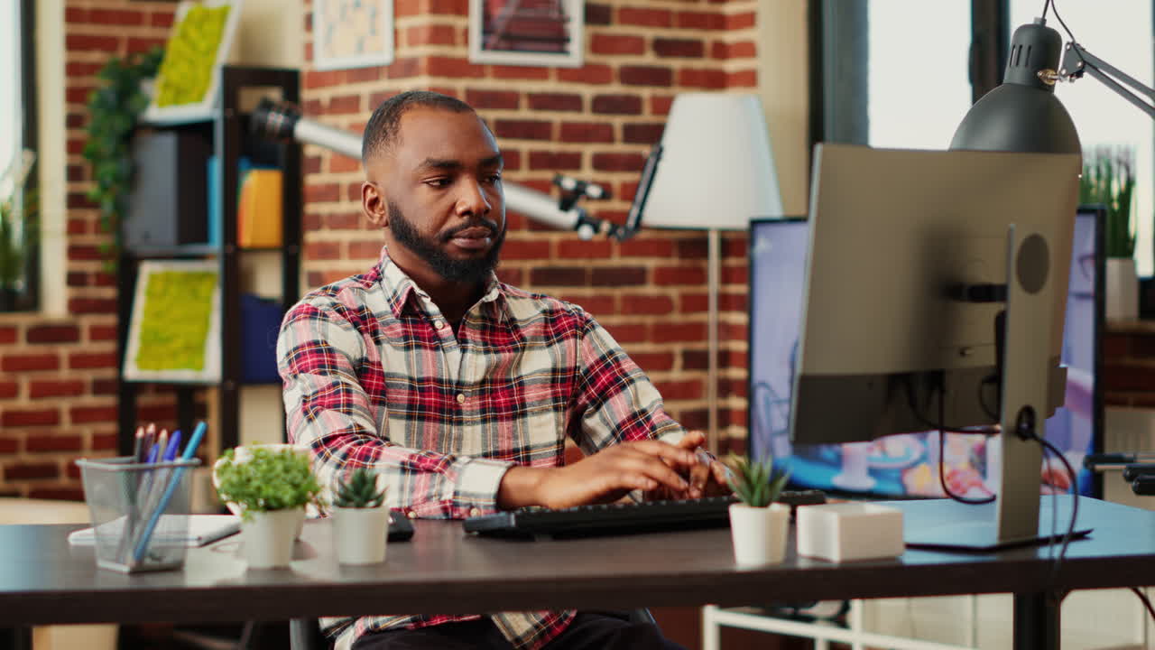 Man working on computer in home office