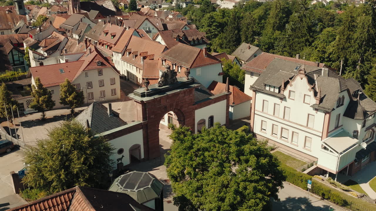 Aerial orbit view of traditional German houses and architecture revealing the townscape and nature in Odenwald