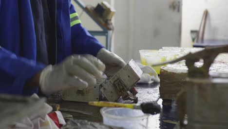 mixed race man working in factory