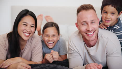 face, happy family and children with smile on bed