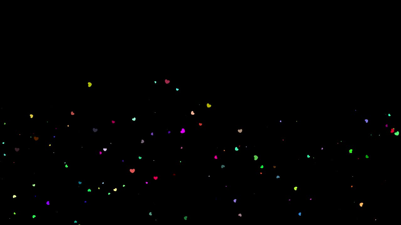 festive magical background. Twinkling, glittering, colored, heart shape particles falling on black background. Flying, flickering, heart shape particles sparkle
