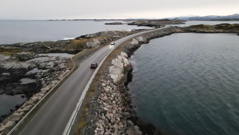 fast driving bmw car at the atlantic ocean roadway in norway