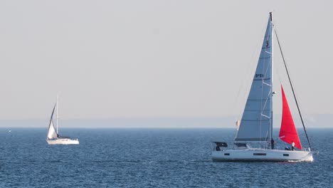 two sailboats navigating the ocean near melbourne