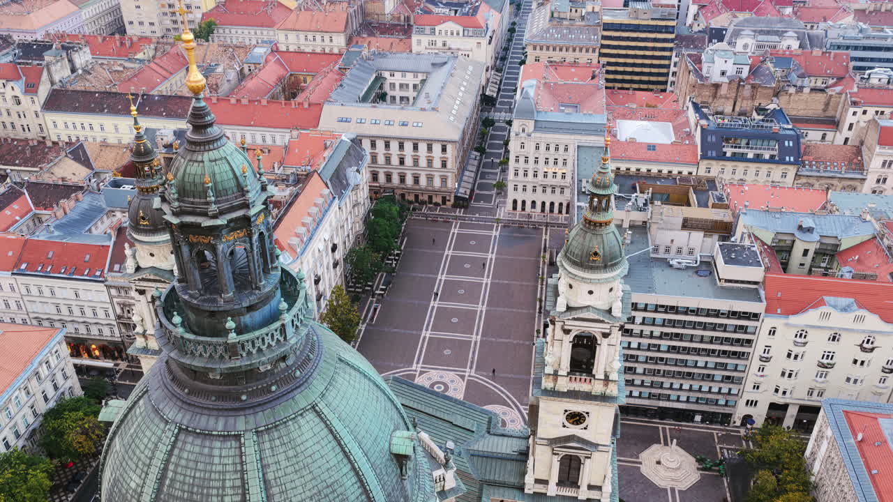 The Basilica’s towers and dome viewed from above, overlooking its patterned square and surrounding streets