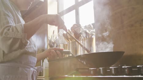 chef cooking vegetables