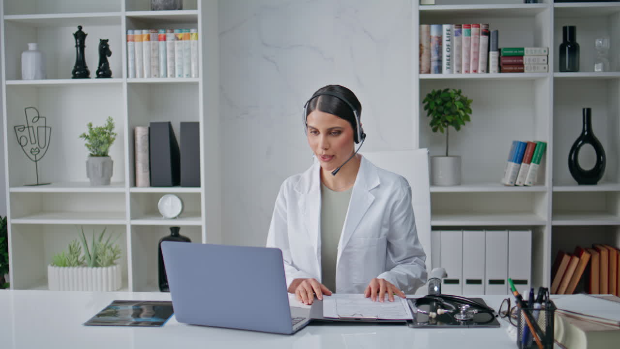 Doctor start online meeting wearing headset in clinic closeup. Woman medic work