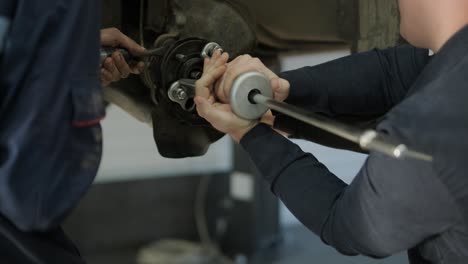 cars undergoing maintenance in auto repair shop