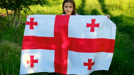 patriot child with georgian flag. selective focus. nature.