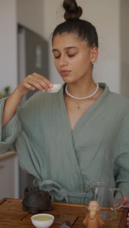 woman performing a tea ceremony indoors