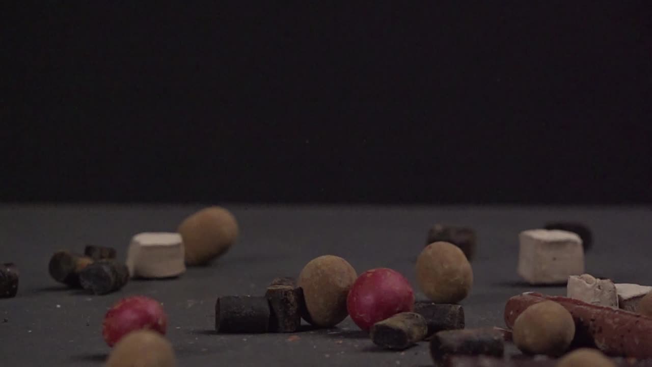 Candy falling at black background in 500fps