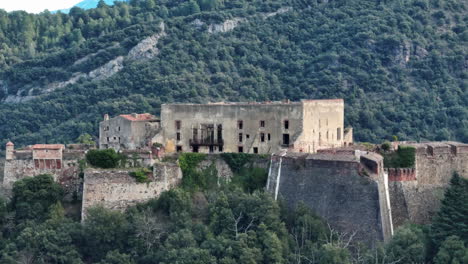 Aerial-sweep-of-Amélie-les-Bains'-historic-fort-standing-tall.