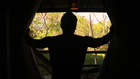 opening the cabin curtain early morning after wake up.