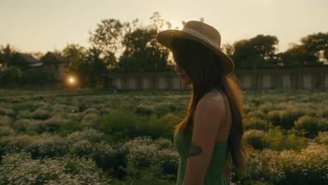 woman in a field at sunset