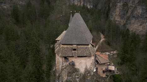 san romedio or saint romedius sanctuary perched on rock, predaia in northern italy